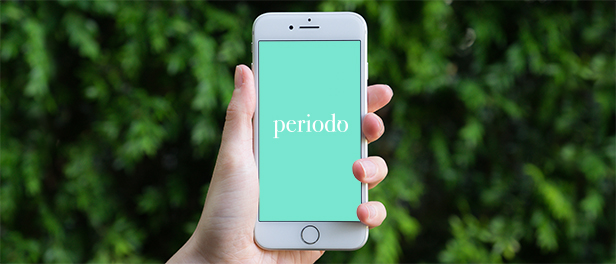 iPhone, auf dem der mintfarbene Startbildschirm der App "periodo" zu sehen ist
